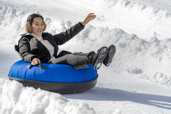 20191202 MHE Tubing Asian Girl earmuffs wave.jpg